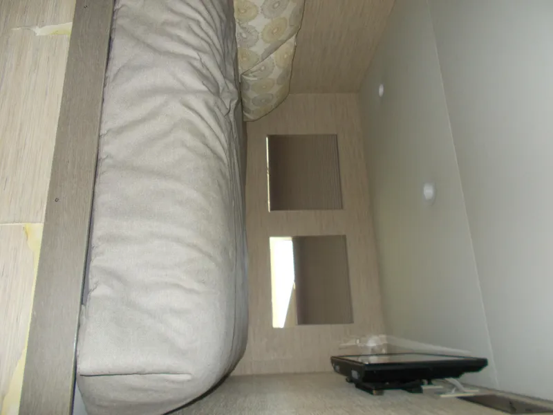 Slide: The Image of Interior of 2016 Adonia Titan Trip 9, featuring a cozy bed and modern decor. - 19