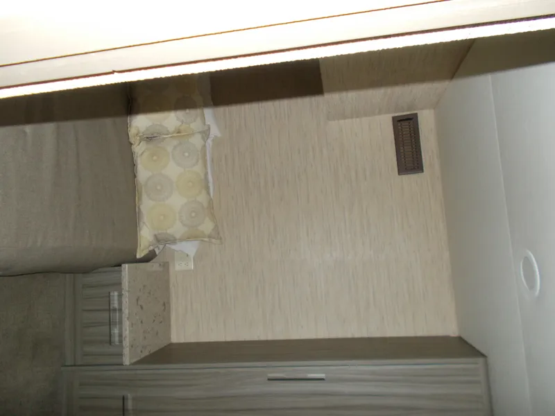 Slide: The Image of Interior of 2016 Adonia Titan Trip 9, featuring a cozy bed and modern decor. - 22