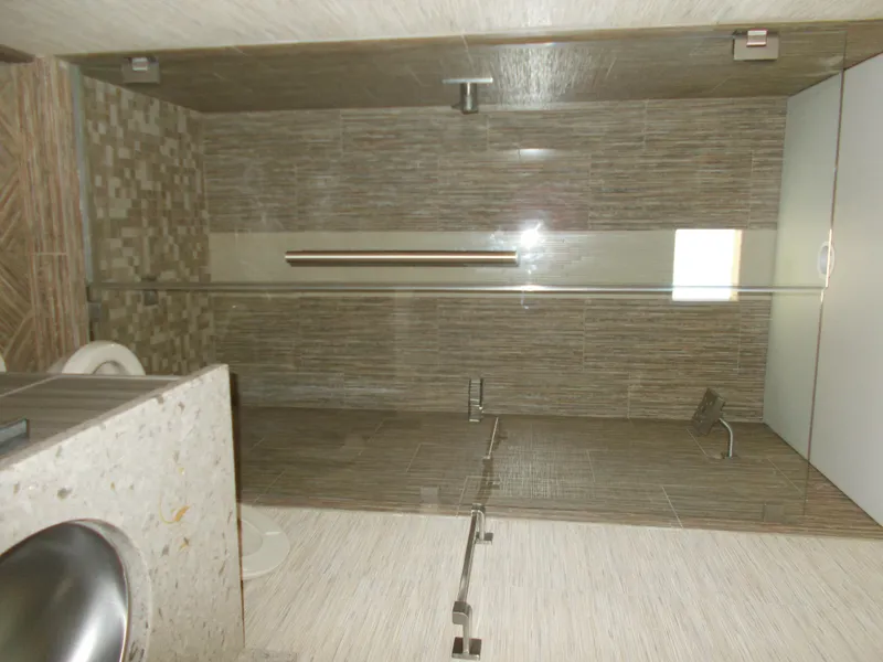 Slide: The Image of Modern bathroom in 2016 Adonia Titan Trip 9, featuring sleek glass shower and stylish fixtures. - 23
