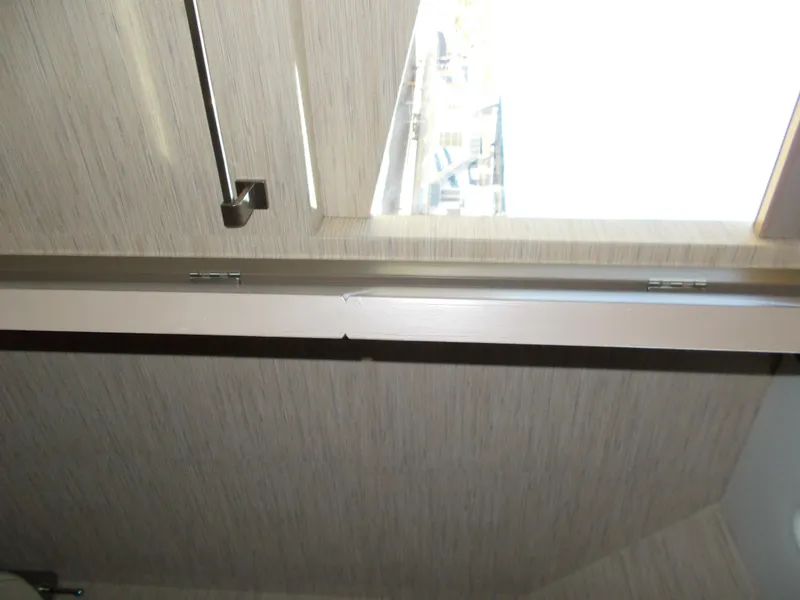 Slide: The Image of Interior view of 2016 Adonia Titan Trip 9, featuring a window and wall detail. - 32