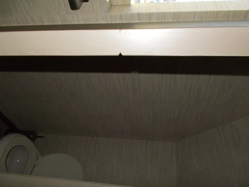 Slide: The Image of Interior of 2016 Adonia Titan Trip 9 bathroom with toilet and textured walls. - 33