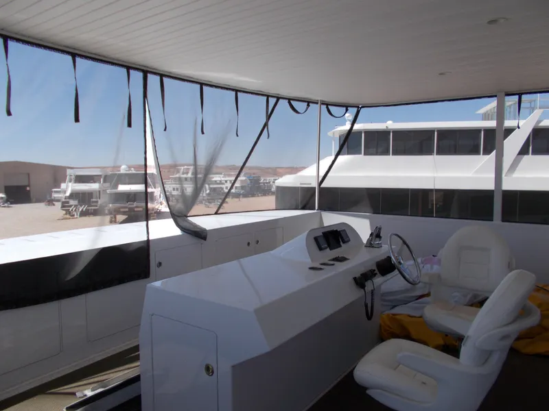 Slide: The Image of Interior view of 2016 Adonia Titan Trip 9 yacht, featuring helm and seating area. - 37