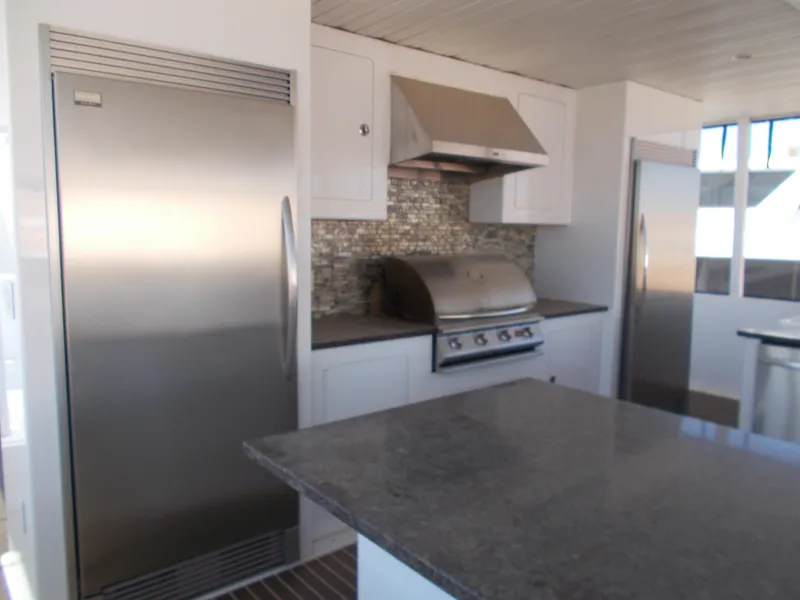 Slide: The Image of Modern kitchen in 2016 Adonia Titan Trip 9, featuring stainless steel appliances and granite countertops. - 42