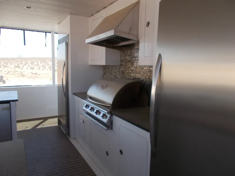 Slide: The Image of Modern kitchen in 2016 Adonia Titan Trip 9, featuring stainless steel appliances and sleek design. - 44