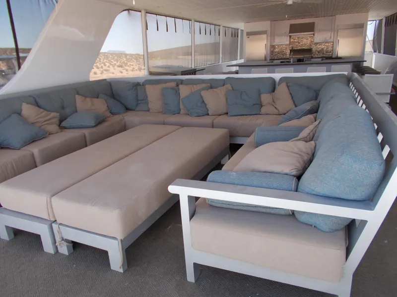 Slide: The Image of Spacious lounge area on 2016 Adonia Titan Trip 9 houseboat with plush seating. - 47