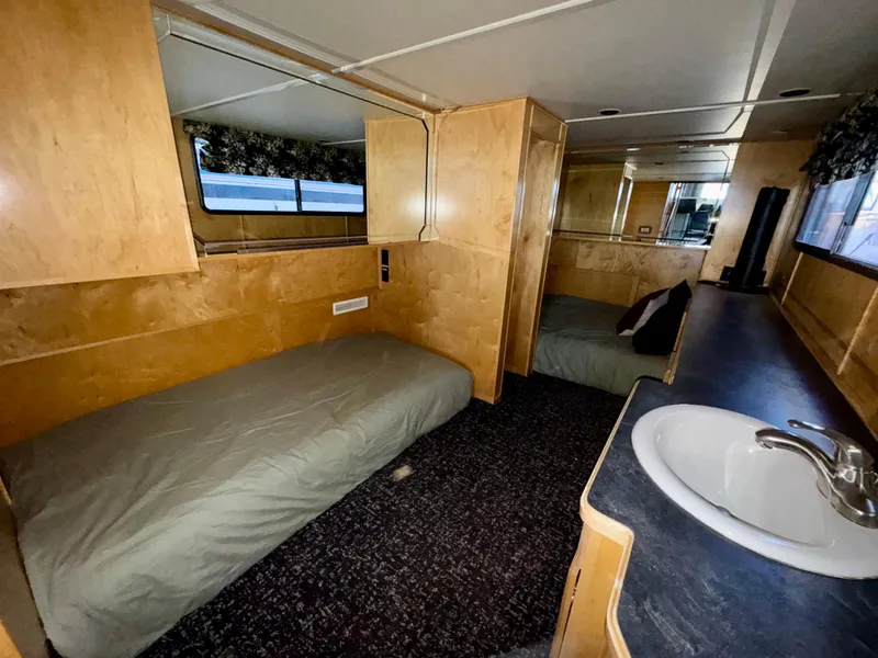 Slide: The Image of Interior of 2008 Sumerset Waterways Houseboat with twin beds and sink. - 10