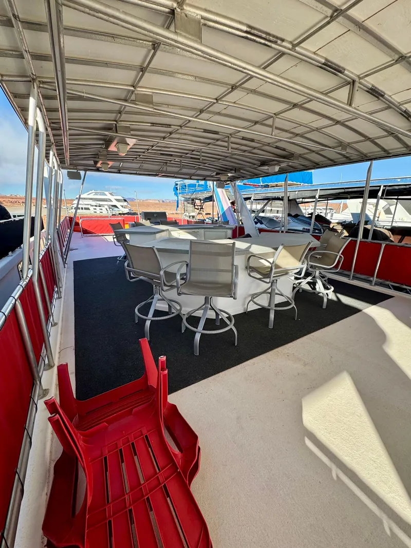 Slide: The Image of 2008 Sumerset Waterways Houseboat deck with chairs and table, Red Rocks Trip #2. - 26