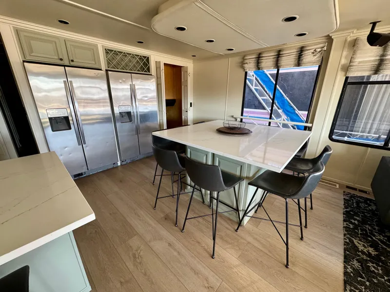 Slide: The Image of Modern kitchen interior of 2008 Sumerset Waterways Houseboat, featuring sleek appliances and a central island. - 6