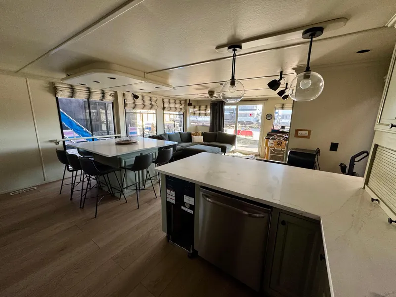Slide: The Image of Interior of 2008 Sumerset Waterways Houseboat with modern kitchen and seating area. - 7