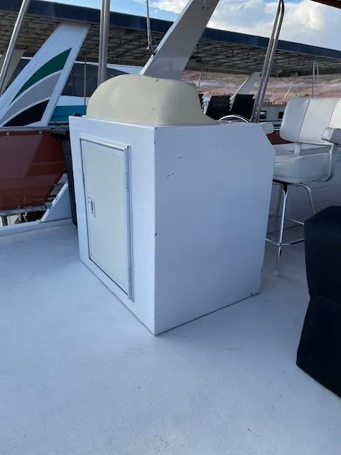 Slide: The Image of 2007 American Waterways Houseboat Sundancer Trip #17, white storage cabinet on deck. - 17