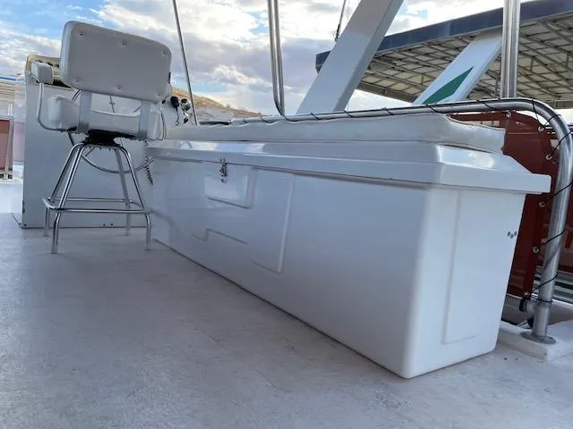 Slide: The Image of 2007 American Waterways Houseboat Sundancer Trip #17 deck with seating and storage. - 18