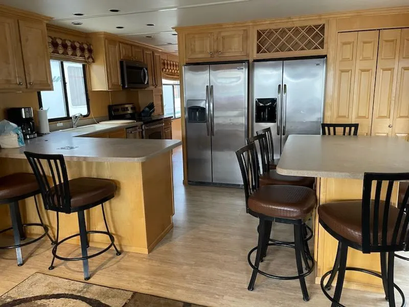 Slide: The Image of Modern kitchen in 2007 American Waterways Houseboat Sundancer Trip #17 with stainless steel appliances. - 21