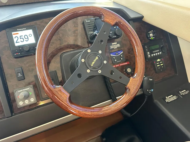 Slide: The Image of Luxurious interior of 2007 Viking Sport Cruiser yacht with plush seating and elegant wood finishes. - 18