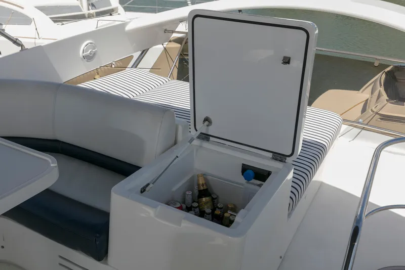 Slide: The Image of Luxurious cabin interior of a 2007 Viking Sport Cruiser yacht with elegant bedding and wood accents. - 27