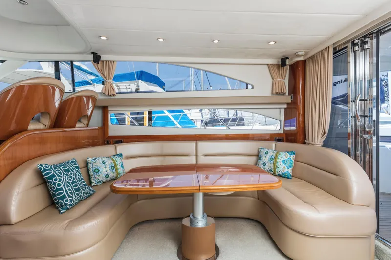 Slide: The Image of 2007 Viking Sport Cruiser yacht interior with helm, seating, and marina view. - 34