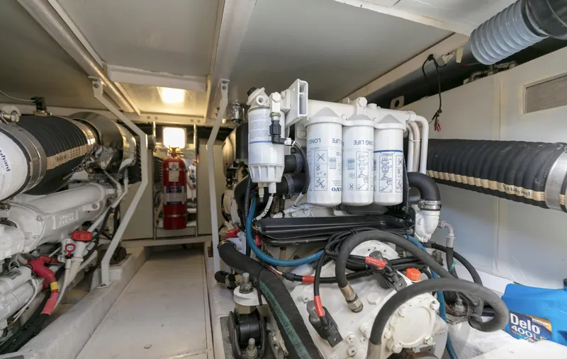 Slide: The Image of Engine room of 2007 Viking Sport Cruiser with visible machinery and equipment. - 48