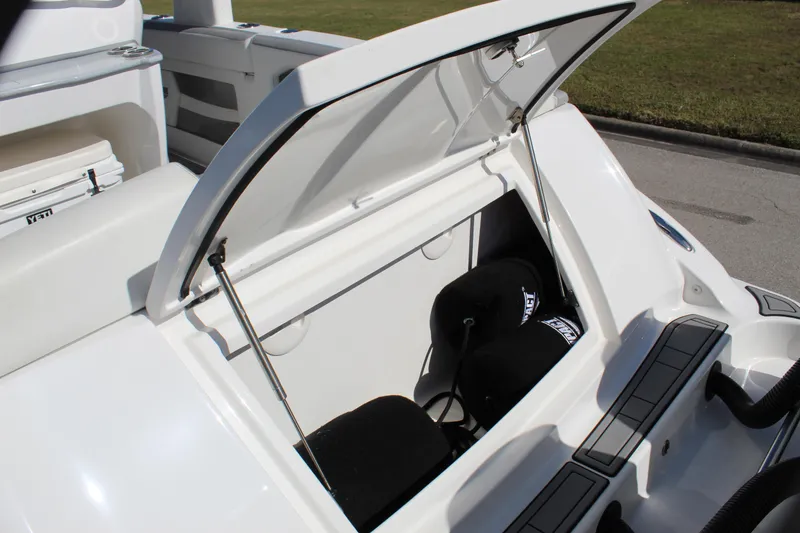 Slide: The Image of Open storage compartment on 2019 Deep Impact 399 Sport boat. - 29