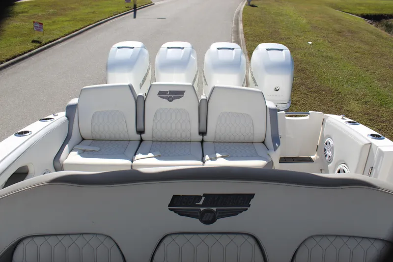 Slide: The Image of 2019 Deep Impact 399 Sport boat with four powerful engines and luxurious seating. - 38