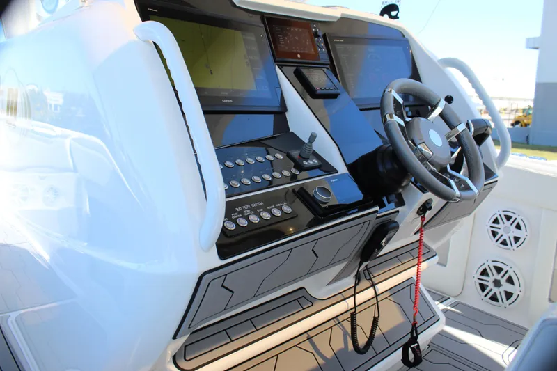 Slide: The Image of 2019 Deep Impact 399 Sport boat dashboard with advanced controls and navigation systems. - 44