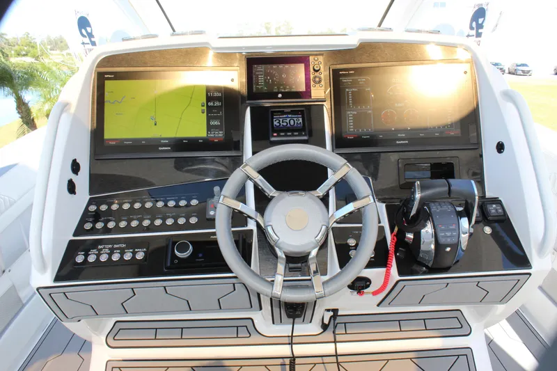 Slide: The Image of Control panel of a 2019 Deep Impact 399 Sport boat with advanced navigation displays. - 48