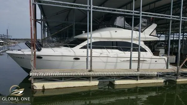 Slide: The Image of 2006 Meridian 411 Sedan yacht docked at marina. - 2