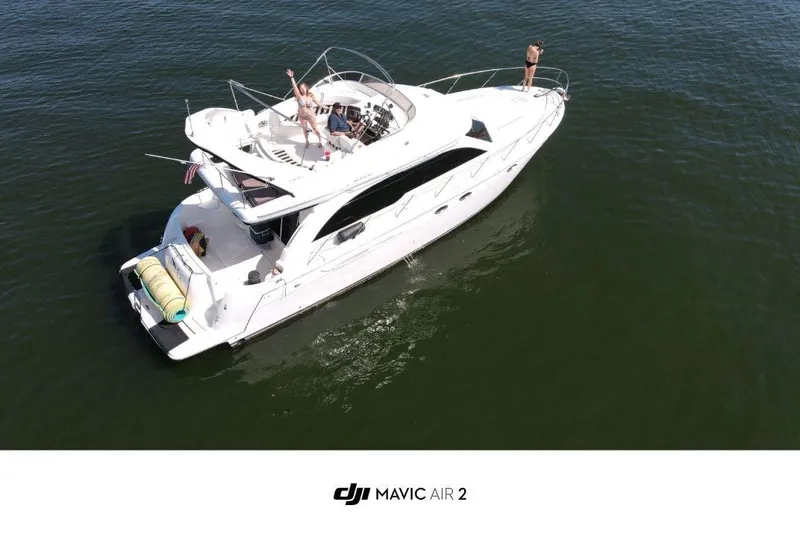 Slide: The Image of Aerial view of 2006 Meridian 411 Sedan yacht on open water. - 5