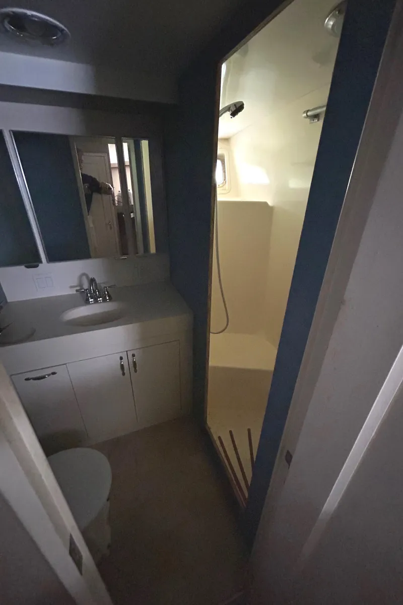 Slide: The Image of Bathroom interior of 1991 Hatteras Cockpit Motor Yacht with shower and vanity. - 12