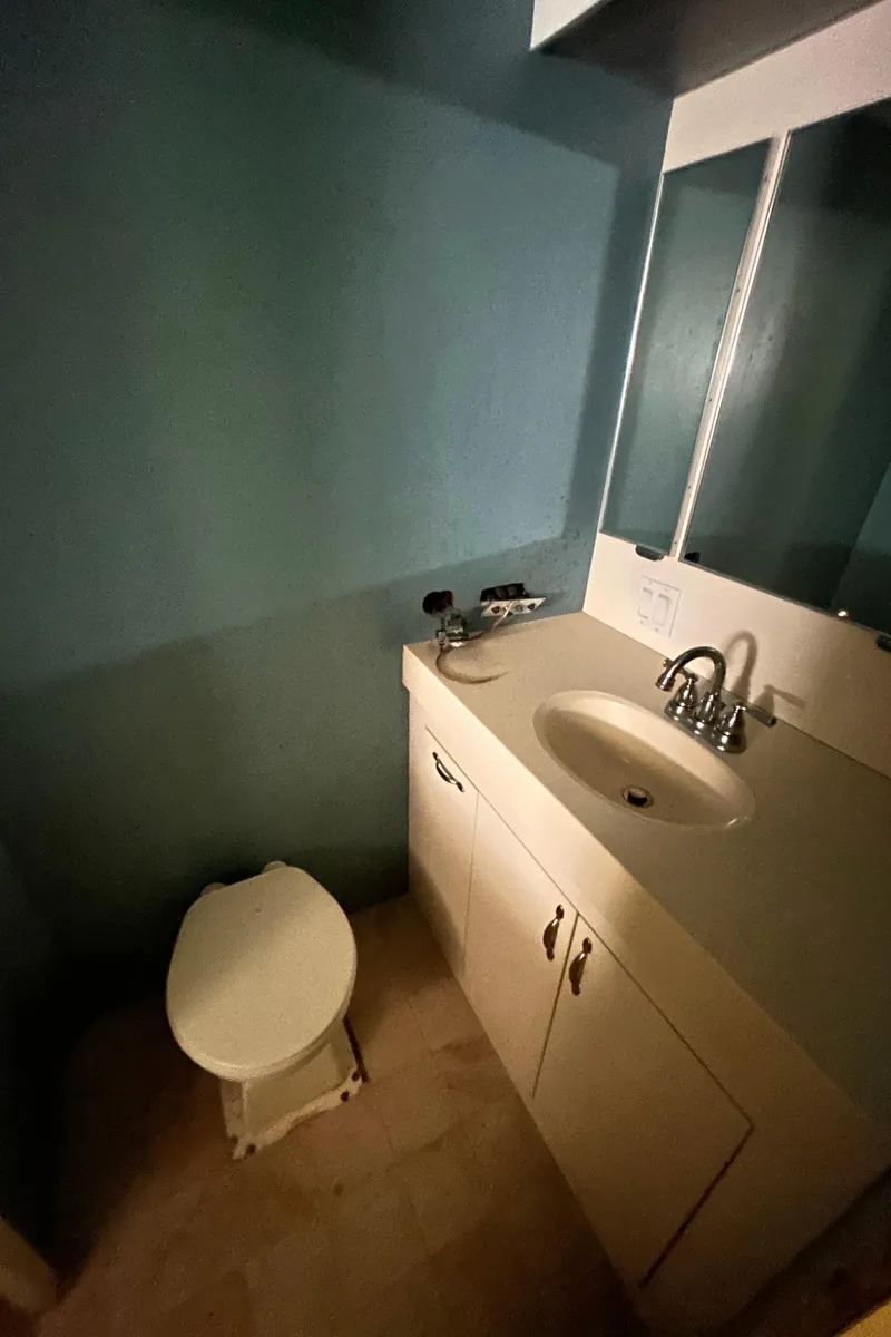 Slide: The Image of Bathroom interior of 1991 Hatteras Cockpit Motor Yacht with sink and toilet. - 13
