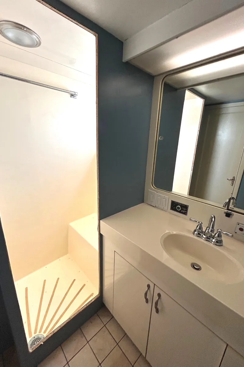 Slide: The Image of Bathroom interior of 1991 Hatteras Cockpit Motor Yacht with sink and shower. - 28