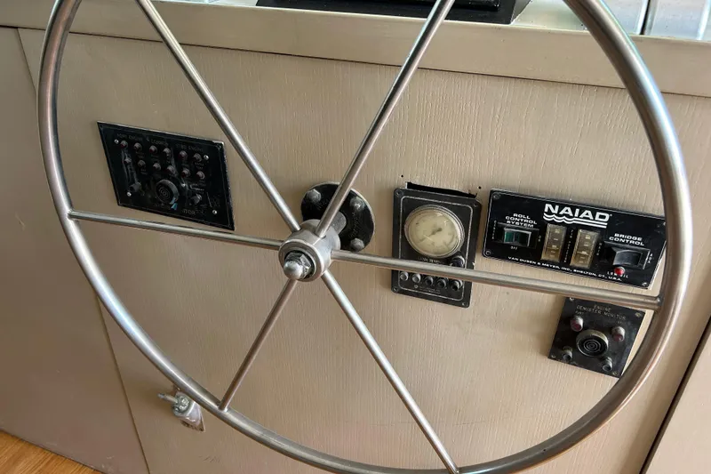 Slide: The Image of Steering wheel and control panel of 1991 Hatteras Cockpit Motor Yacht. - 34