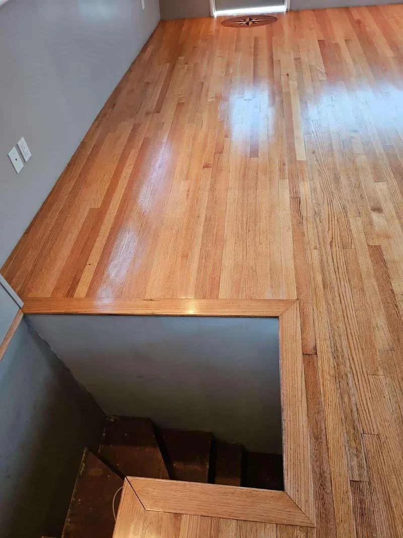 Slide: The Image of Polished wooden floor with stairway opening on a 1991 Hatteras Cockpit Motor Yacht. - 38