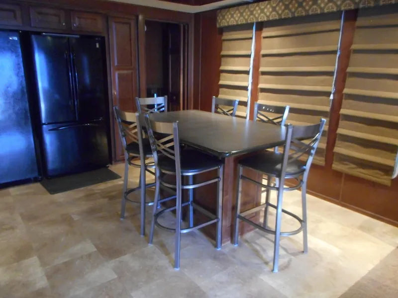 Slide: The Image of Modern kitchen with dark wood cabinets and breakfast bar, 2008. - 10