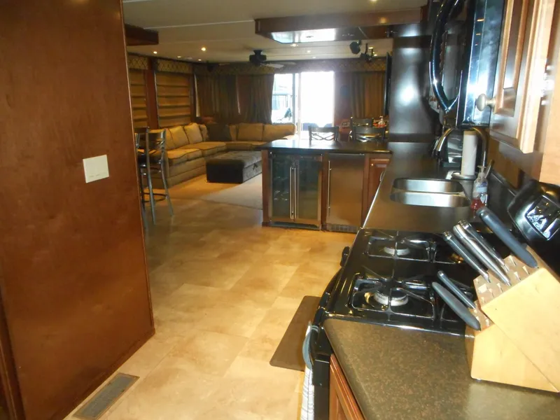 Slide: The Image of Modern kitchen and living area in a 2008 Sharpe houseboat. - 22
