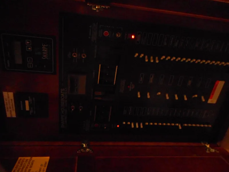 Slide: The Image of Sharpe Kohala Sun Trip 2008 electrical panel in dim lighting. - 23
