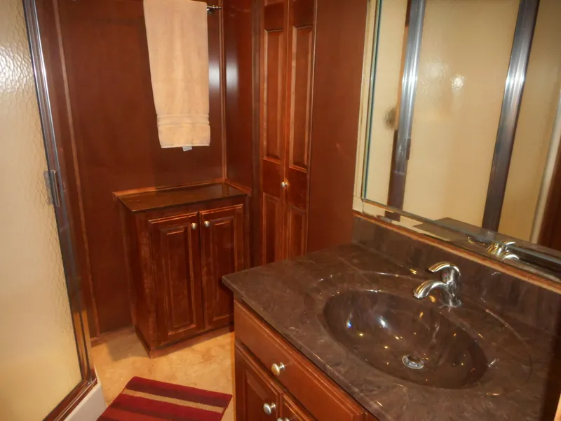 Slide: The Image of Luxurious bathroom with wooden cabinets and marble sink, Sharpe Kohala Sun Trip 2008. - 24