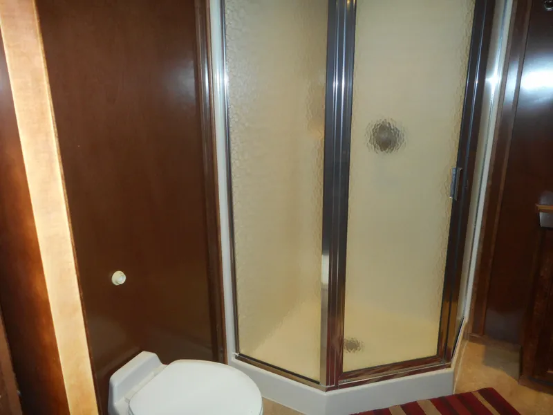 Slide: The Image of Bathroom with shower enclosure and toilet in Sharpe Kohala Sun Trip 2008. - 25