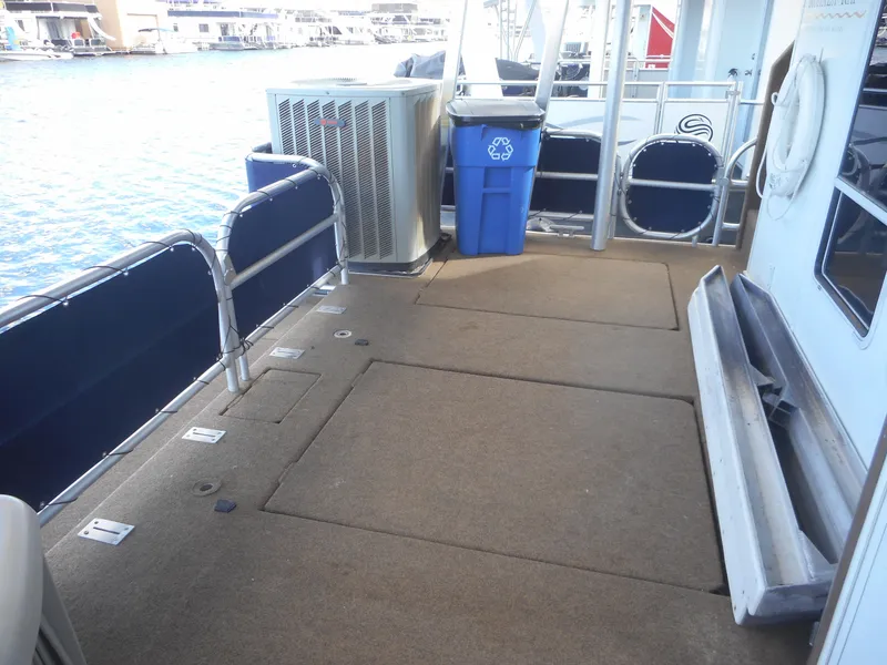 Slide: The Image of Deck of a 2008 Sharpe Kohala Sun Trip boat with recycling bin. - 37