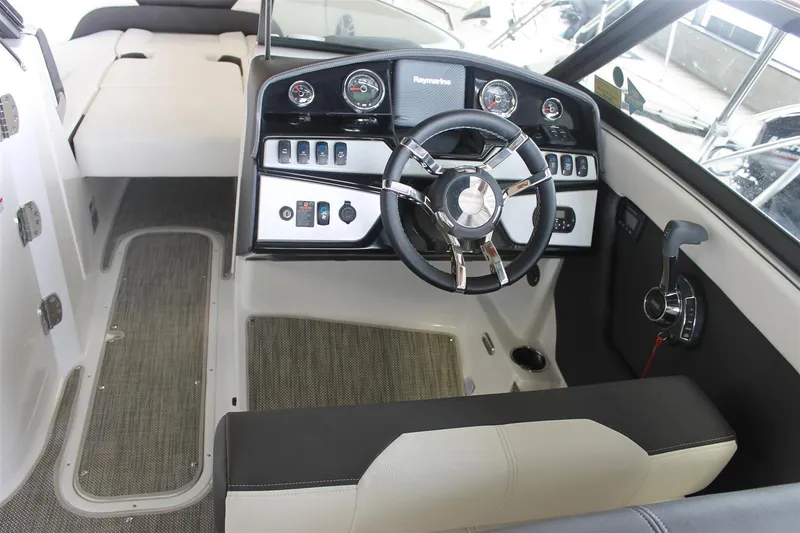 Slide: The Image of 2018 Bryant Potenza boat interior with steering wheel and control panel. - 10