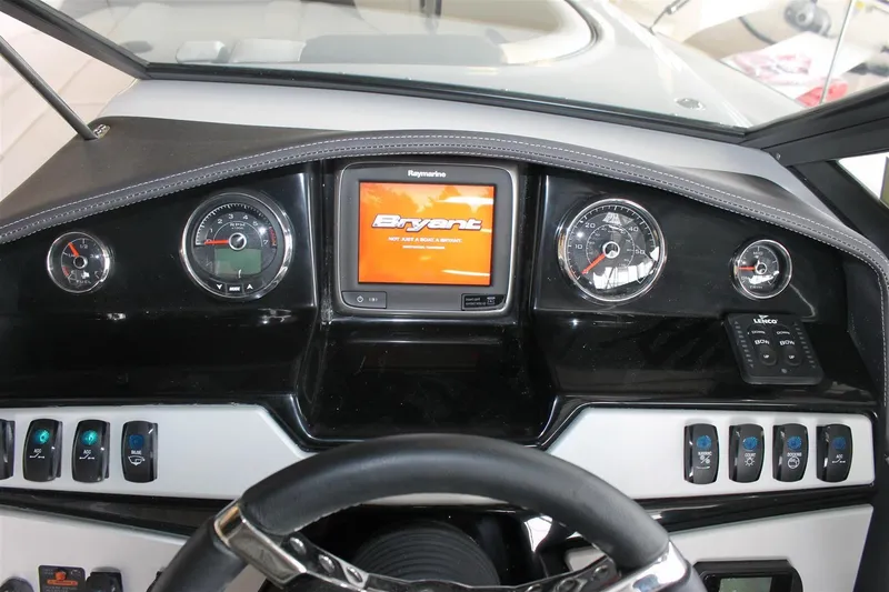 Slide: The Image of Dashboard of a 2018 Bryant Potenza boat with gauges and control panel. - 12