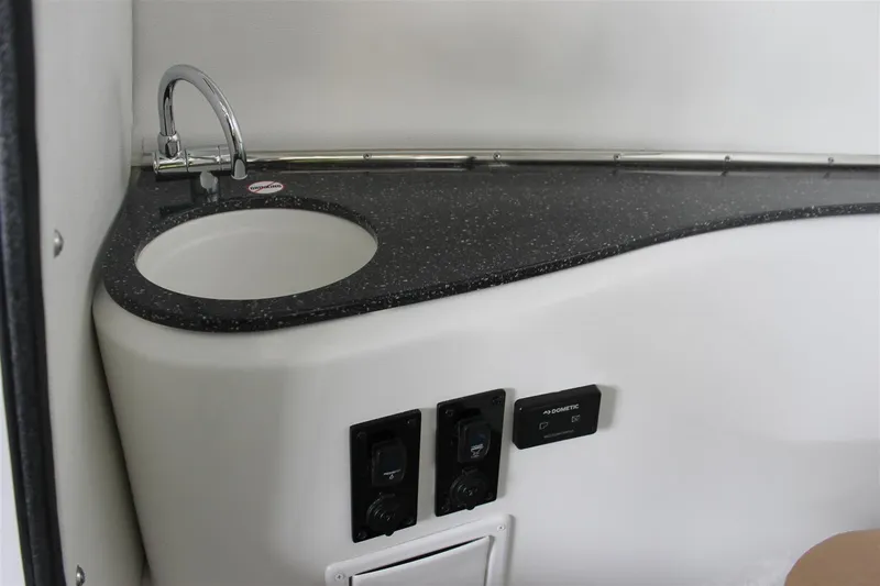 Slide: The Image of 2018 Bryant Potenza boat interior with sink and control panel. - 15