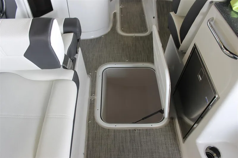 Slide: The Image of 2018 Bryant Potenza boat interior with open storage compartment and seating. - 18