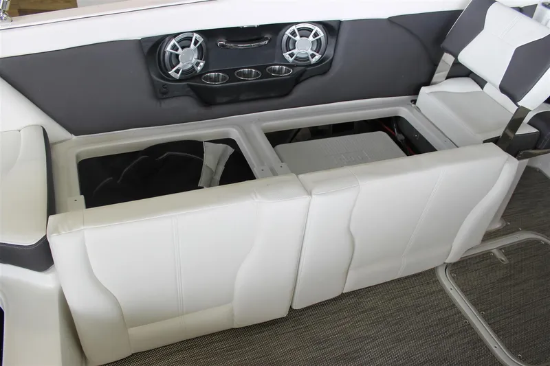 Slide: The Image of Interior of a 2018 Bryant Potenza boat with white seating and built-in speakers. - 19