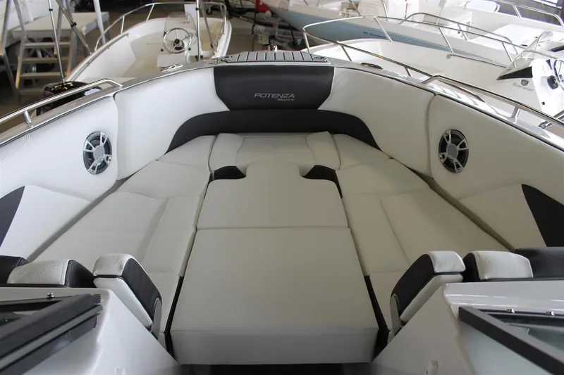 Slide: The Image of 2018 Bryant Potenza boat interior with cushioned seating and speakers. - 21