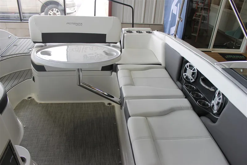Slide: The Image of 2018 Bryant Potenza boat interior with white seating and round table. - 25