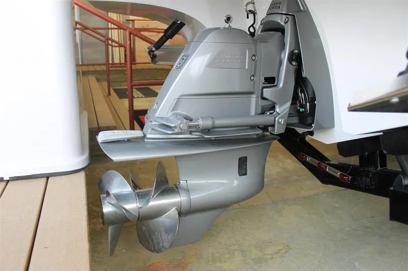 Slide: The Image of 2018 Bryant Potenza boat engine with propeller, displayed indoors. - 27