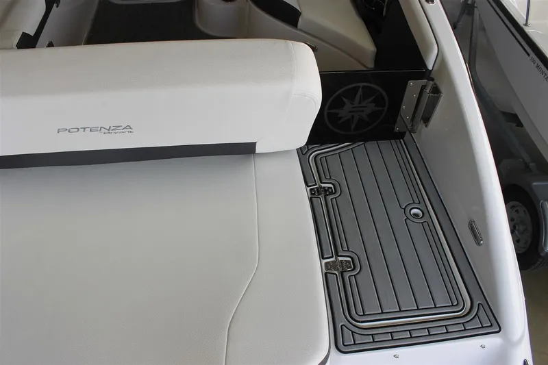 Slide: The Image of 2018 Bryant Potenza boat interior with white seating and gray flooring. - 4
