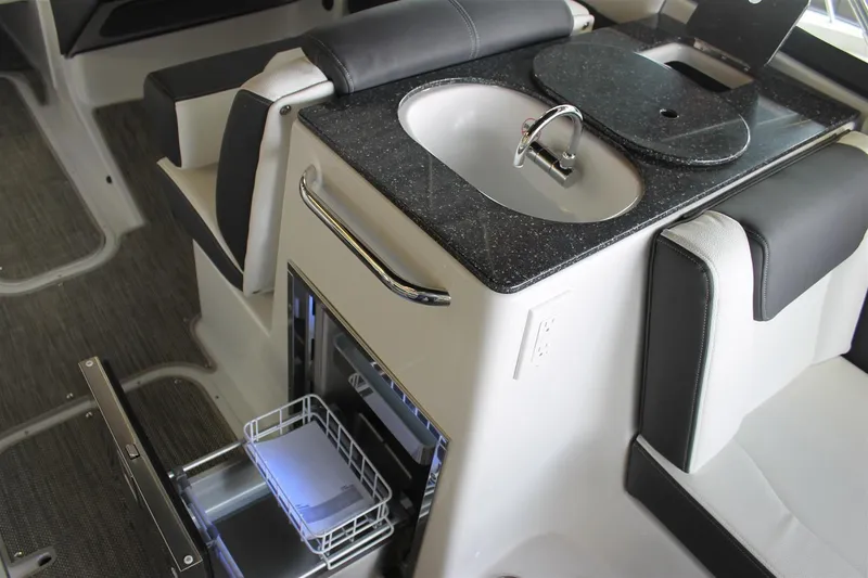 Slide: The Image of 2018 Bryant Potenza boat interior with sink, countertop, and storage compartments. - 5