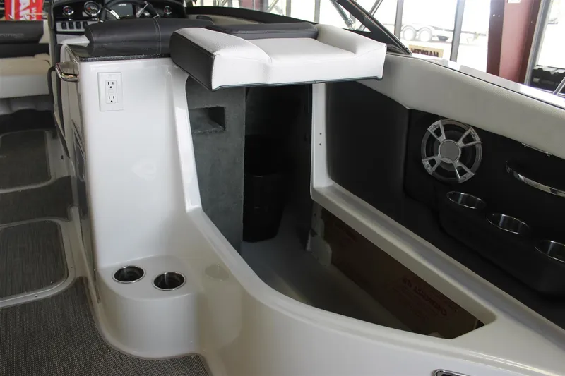 Slide: The Image of Interior of a 2018 Bryant Potenza boat featuring seating and speaker system. - 8