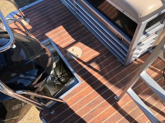 Slide: The Image of 2013 South Bay 726 CR boat deck with Yamaha engine and seating area. - 10