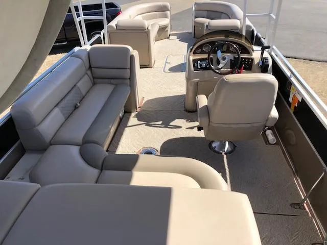 Slide: The Image of Luxurious interior of a 2013 South Bay 726 CR pontoon boat with plush seating. - 11